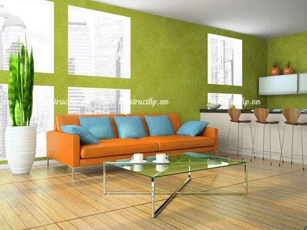 Ghế sofa màu cam kết hợp sơn tường màu xanh lá